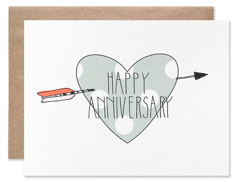 Large green with white polka dot heart with a neon arrow through it. Written over top is Happy Anniversary. All illustrated by Hartland Brooklyn.
