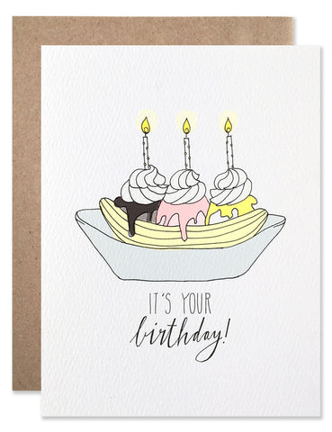 Banana split with candles in the 3 scoops of ice cream. Illustration by Hartland Brooklyn.