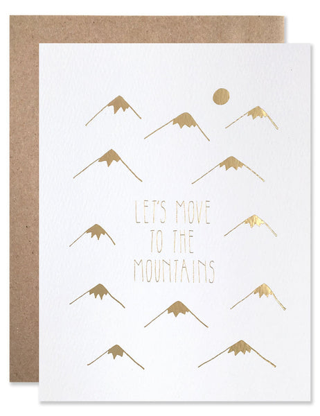 Stamped in gold foil tiny little mountains with the text "Let's Move to the Mountains" centered. Illustrated by Hartland Brooklyn