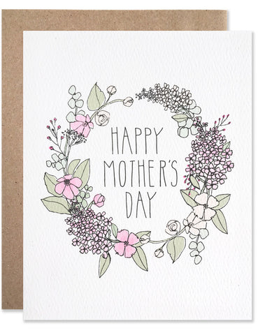 Floral wreath of lilacs in pinks with happy mother's day written in the center. Illustrated by Hartland Brooklyn