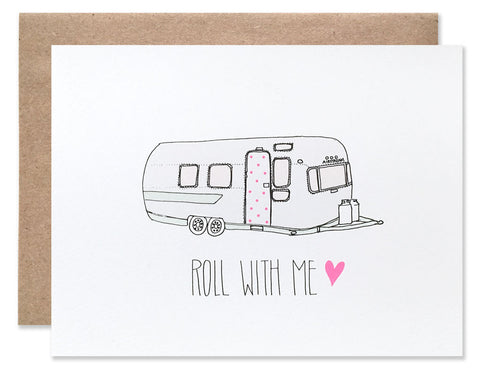 Vintage airstream trailer with a pink polka dot door with 'Roll with me' written below. Illustrated by Hartland Brooklyn.