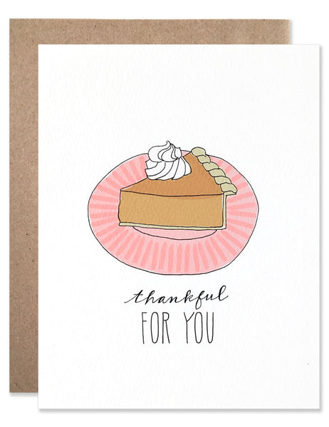 Slice of pumpkin pie with whipped cream on a pink plate illustrated by Hartland Brooklyn