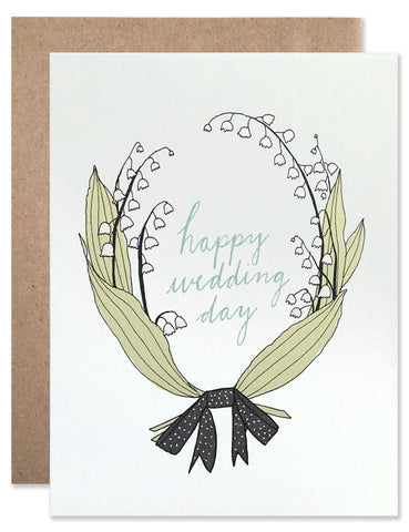 lily of the valley sprigs creating a laurel around the words Happy Wedding Day. Illustrated by Hartland Brooklyn